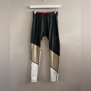 Janji Black, Gold, and White Leggings